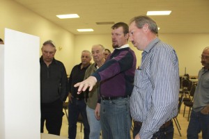 Cattle farmer Doug Caldwell is explaining the agroforestry and cattle wintering project to Doug Turnbull and others on the UARCD.
